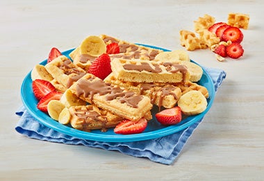 Tres waffles con toppings diferentes, una muestra de la variedad de recetas. 