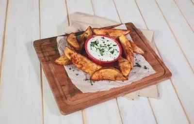 PAPAS con PAPRIKA y AJO preparadas con CARNATION® CLAVEL® Origen Coco PAPAS con PAPRIKA y AJO preparadas con CARNATION® CLAVEL® Origen Coco