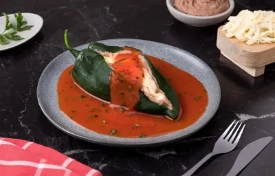 Chiles Rellenos de Queos con Frijoles